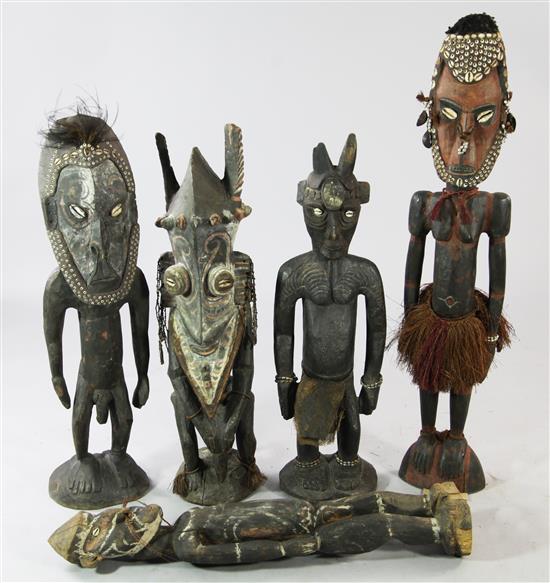 A Sepik River carved wooden female ancestor figure & four male figures